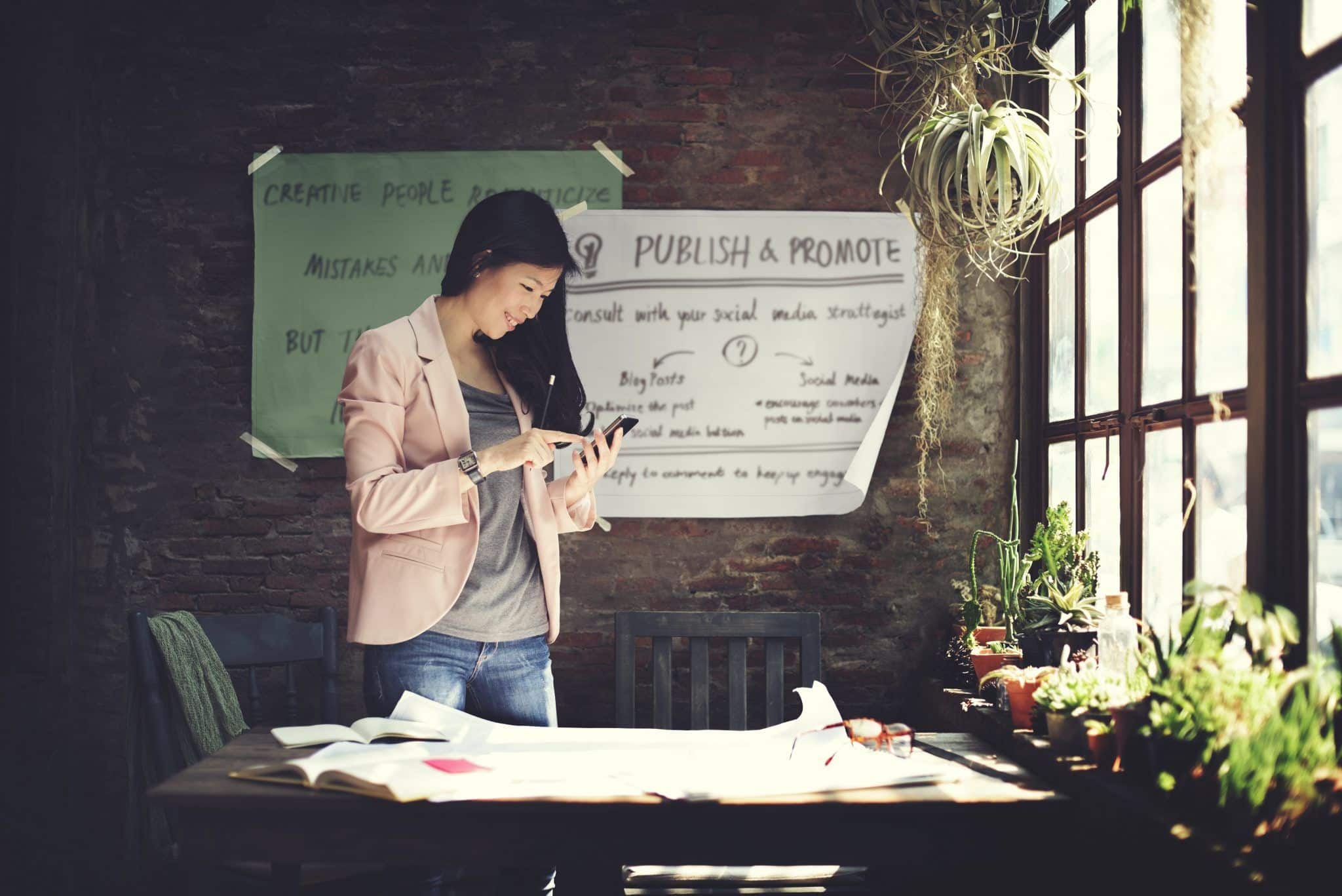 marketing professional smiling at her phone
