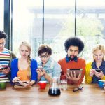 group of people looking at mobile devices