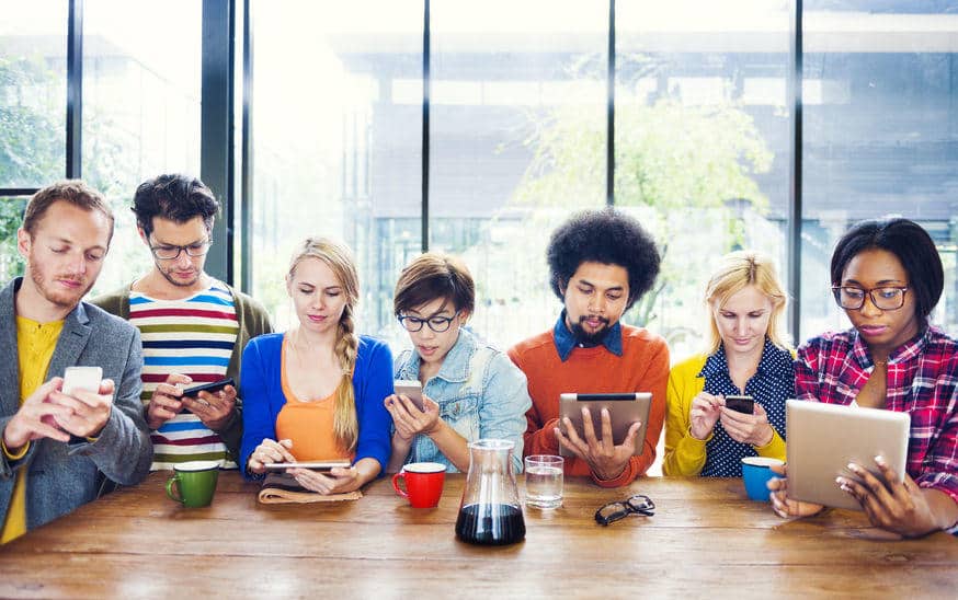 group of people looking at mobile devices