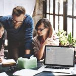 a marketing team discussing and planning their audience strategy