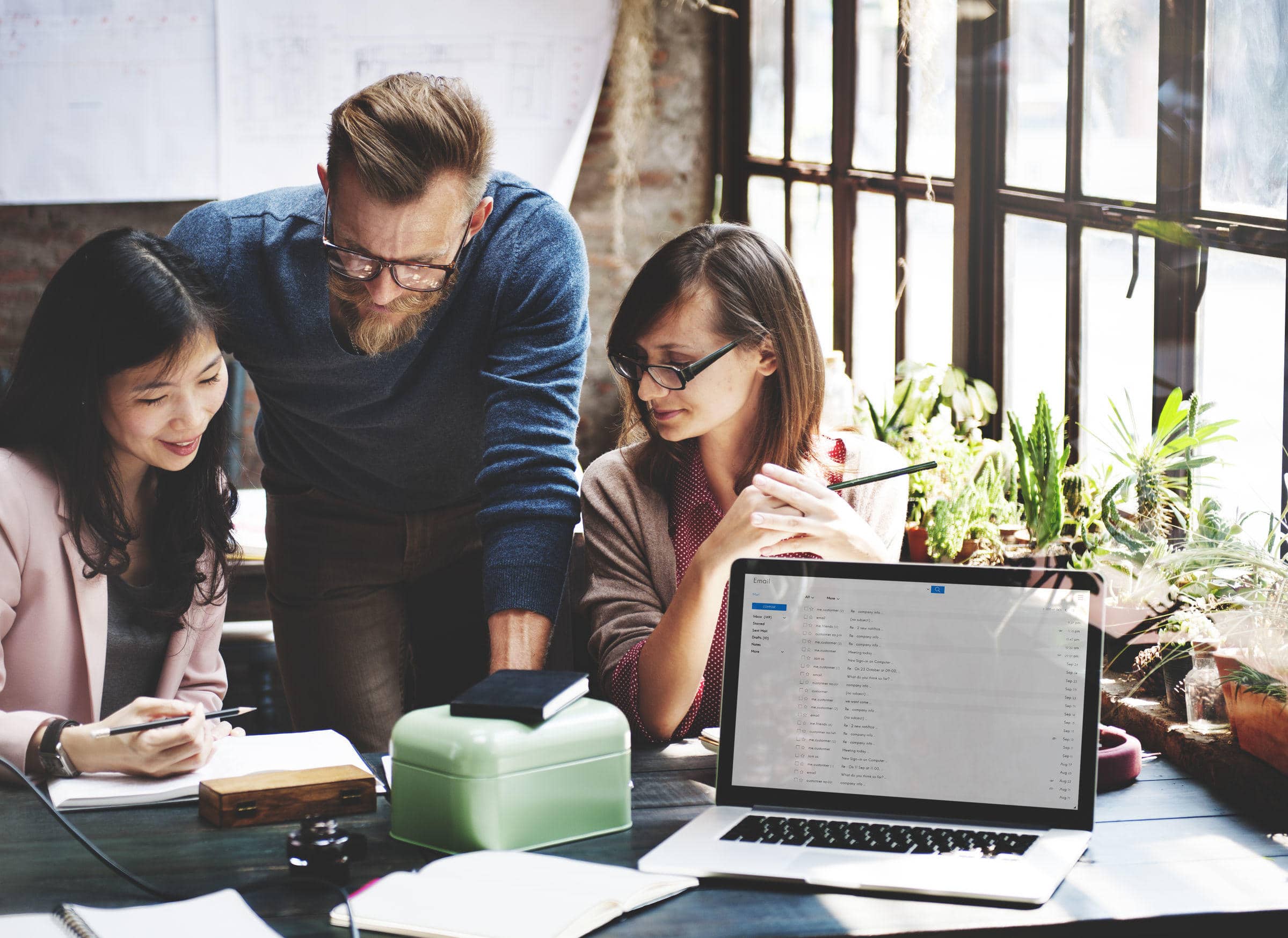 a marketing team discussing and planning their audience strategy
