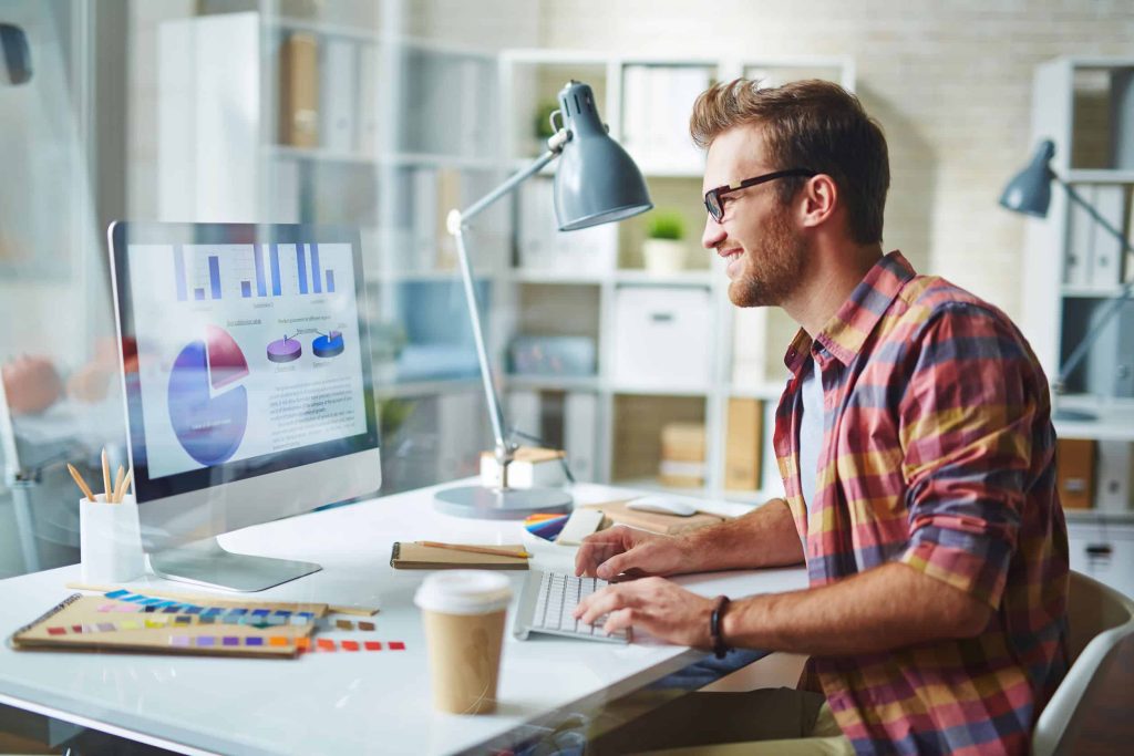 a designer at his computer analyzing the body of his website