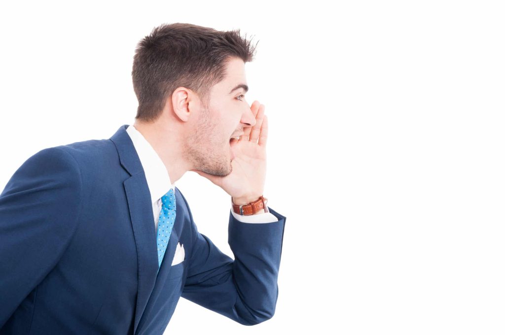 A salesman in a nice suit shouting about how great his product is