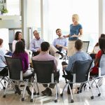 businesswoman discussing the company’s mission with her team