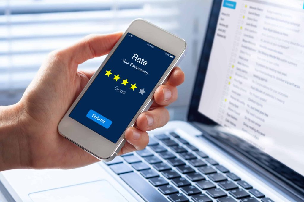 someone rating a company by leaving a review on their smartphone