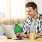 a man seeing an ad on his laptop while working from home