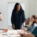 marketing team listening to a flywheel marketing strategy presentation