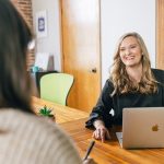 Kelly Rice, fractional CMO from Treefrog Marketing, talking with client Title: Fractional CMO vs. Full-Time CMO: Which Is Right for Your Small Business?