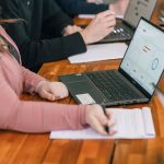 Treefrog team member on laptop using must-have small business tools