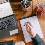 Laptop and notepad on a table